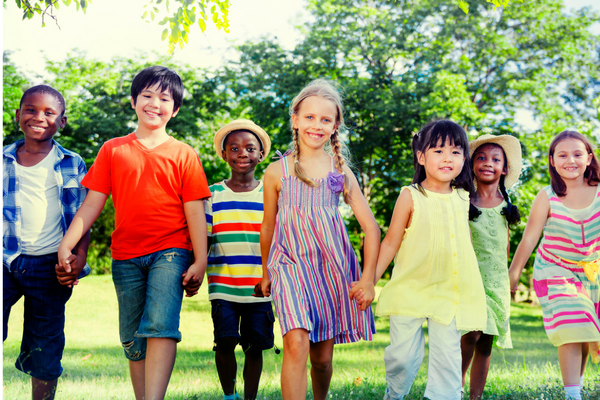 group of diverse children holding hands