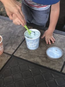 Toddler hands getting ice cream